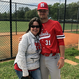This is a photo of Joanne Schneider and her son, Sam, who is a first-year catcher on the Saint Mary’s baseball team.